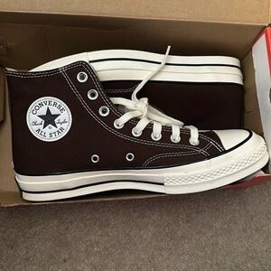 Brown Chuck 70 high top Converse (size 10 in women’s and 8 in men’s).